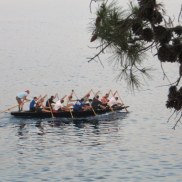 A rowing crew -- or shall I say paddling as they used canoe paddles, not oars -- passed by as we ate.